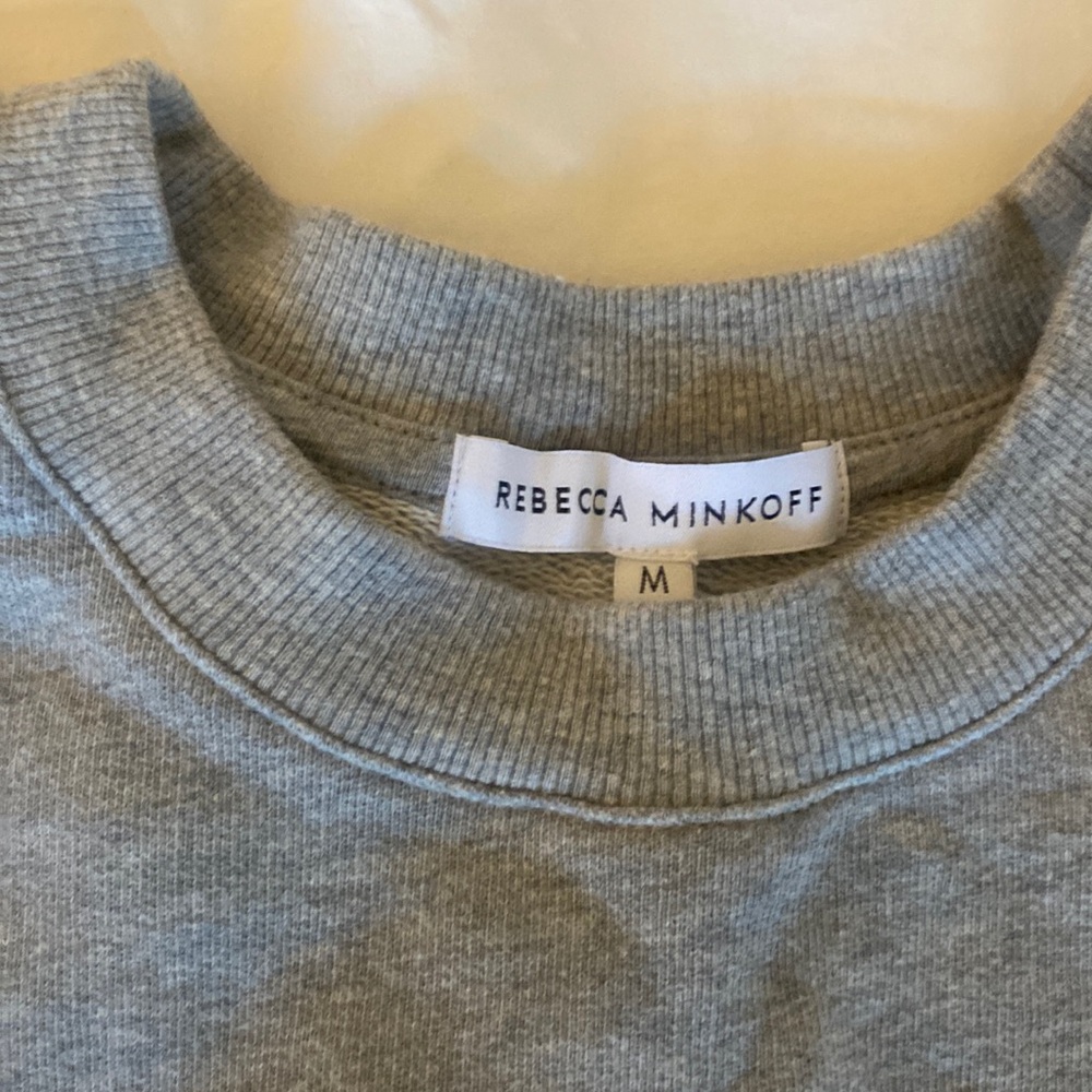 Very cute sweatshirt with white ruffled sleeves
